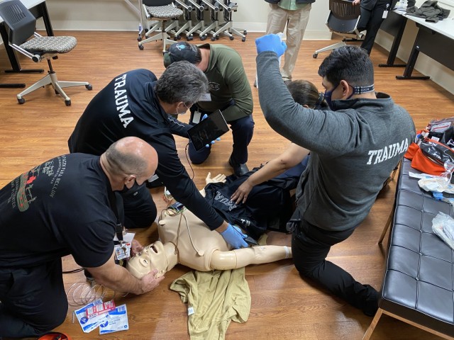 Instructors assigned to the U.S. Army Medical Center of Excellence (MEDCoE) Army Trauma Training Course, Miami Florida, demonstrate trauma scenario training for surgical teams as part of their pre-deployment training August 2021