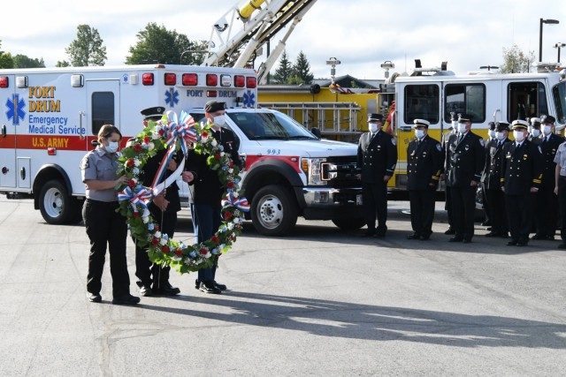 Fort Drum community members joined fire and law enforcement personnel Sept. 10 at the “Lest We Forget” monument outside Clark Hall to reflect on the 20th anniversary of 9/11. (Photo by Mike Strasser, Fort Drum Garrison Public Affairs)