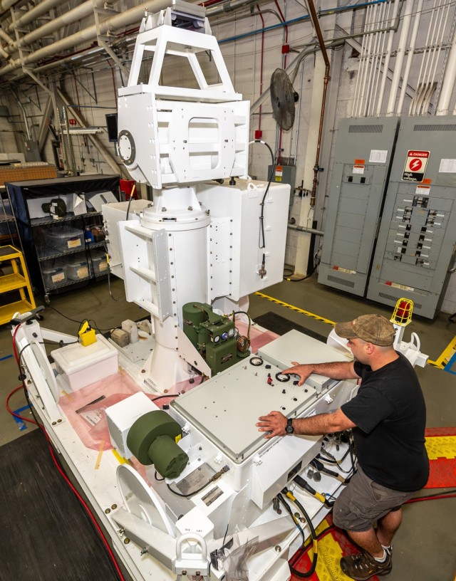 Cory Smith, electronic integrated systems mechanic, in the depot’s C4ISR Directorate’s ATCALS/Range Threat Systems Division, checks the direct current voltages during the initial turn on of an Air Force AN/TPT-T1 Unmanned Threat Emitter (UMTE) System. The UMTE is an U.S. Air Force aircrew training system that is environmentally rugged, unmanned and remotely operable. It is capable of radiating threat signals that simulate surface-to-air missiles and anti-aircraft artillery radar, and can be airlifted to various training sites.