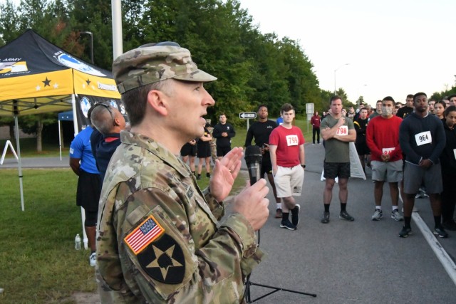 Chaplain (Lt. Col.) Tom McCort, Fort Drum garrison chaplain, spoke with runners at the starting line, as more than 500 community members gathered outside Magrath Sports Complex on Sept. 10 to participate in the 9/11 Memorial 5K Run.