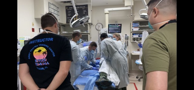 As instructors oversee, an Army Forward Resuscitative Surgical Team (FRST) participates in trauma scenario training provided by the Army Trauma Training Detachment and Ryder Trauma Center at Jackson Memorial in Miami, Florida, as part of their pre-deployment training August 2021.