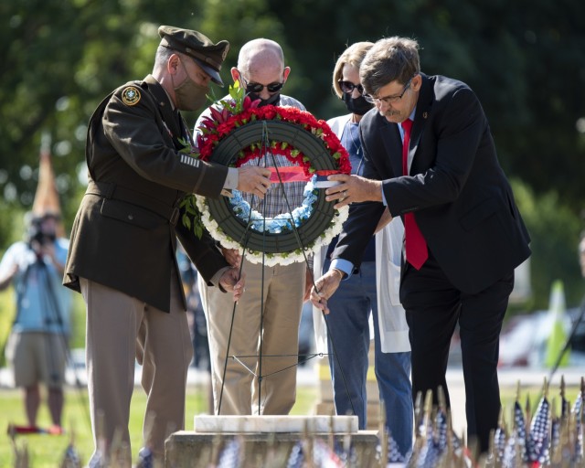 Lt. Gen. Antonio Aguto Jr., commanding general, First U.S. Army, participates in placing a remembrance wreath at the 9/11 Memorial, Rock Island Arsenal, Illinois, Sept. 10, with retired Command Sgt. Maj. Stephen Blake, and Leonard and Brenda...
