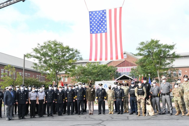 Fort Drum community members joined fire and law enforcement personnel Sept. 10 at the “Lest We Forget” monument outside Clark Hall to reflect on the 20th anniversary of 9/11. (Photo by Mike Strasser, Fort Drum Garrison Public Affairs)