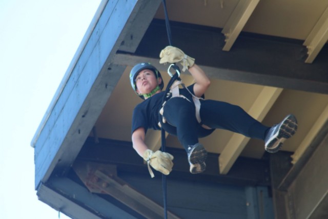 Specialist Ana Cea, 716th Military Police Battalion, rappels from a tower Sept. 2 at The Sabalauski Air Assault School during the inaugural Army Chaplain Experience Day. The event brought in dozens of chaplain candidates from across the U.S. to learn the ins and outs of the role.