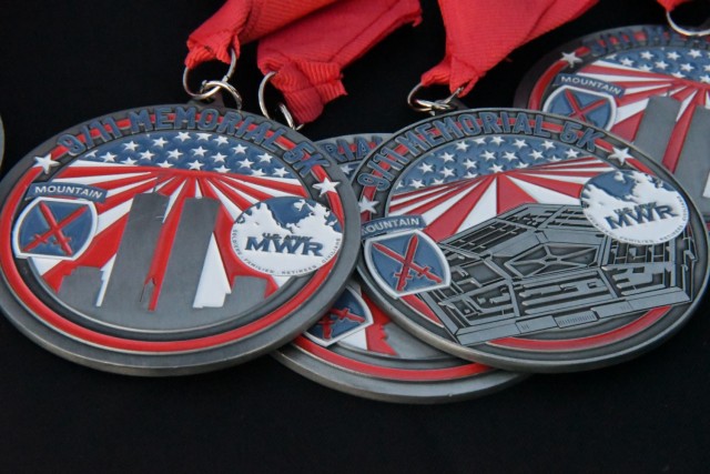 More than 500 runners gathered outside Magrath Sports Complex on Sept. 10 to participate in the 9/11 Memorial 5K Run. A finisher’s medal was designed for the event to commemorate the 20th anniversary of 9/11. (Photo by Mike Strasser, Fort Drum Garrison Public Affairs)
