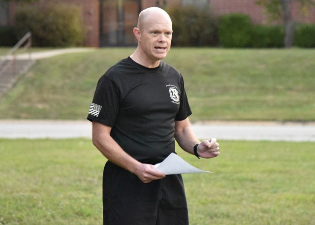 U.S. Army Chemical, Biological, Radiological, and Nuclear School Ethics Instructor and Regimental Chaplain (Maj.) Jason Southard addresses a group of nearly 50 CBRN Soldiers, who volunteered to participate in a sunrise 5k run Sept. 10. The run ― which started and finished in front of the Digital Training Facility ― gave the group the chance to come together to reflect on 9/11 and the ensuing Global War on Terror, and their roles as service members.