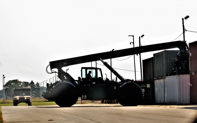 An operator with the Fort McCoy Logistic Readiness Center (LRC) Transportation Division Unit Movements Section operates an Army Standard 50,000-pound-capable Rough Terrain Container Handler (RTCH) on Aug. 20, 2021, at the division’s building on...