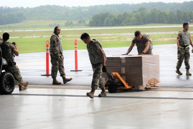 Airmen move cargo Aug. 5, 2021, at the Sparta-Fort McCoy Airport at Fort McCoy, Wis., in preparation for the exercise Patriot Warrior 2021. Patriot Warrior is Air Force Reserve Command's premier exercise, providing an opportunity for Reserve...