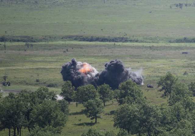 A 500-pound Joint Direct Attack Munition explodes on a target in the impact area after being dropped from an Air Force F-16 Fighting Falcon at Fort McCoy, Wis., on Aug. 13, 2021. The fighter jet action was part of the Northern Lightning 2021...