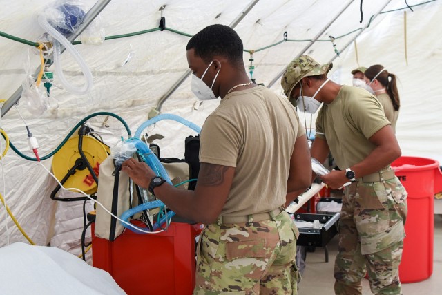 The 159th Medical Group Chemical, Biological, Radiological/Nuclear, and Explosive (CBRNE) Enhanced Response Force Package sets up mobile medical stations at the Terrebonne General Health System in Houma to augment a badly damaged hospital in the aftermath of Hurricane Ida on Sept. 6, 2021. (Photo by Staff Sgt. Ryan Sonnier)