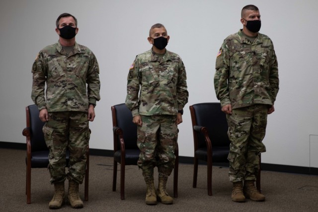 The official party stands for the singing of the Army song during the 86th Training Division assumption of command ceremony, Sept. 11, at Fort McCoy, Wis. The party consisted of, from left to right) Brig. Gen. Robert E. Guidry, commanding general,...