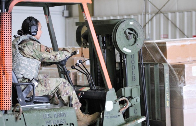 Airmen move cargo Aug. 5, 2021, at the Sparta-Fort McCoy Airport at Fort McCoy, Wis., in preparation for the exercise Patriot Warrior 2021. Patriot Warrior is Air Force Reserve Command's premier exercise, providing an opportunity for Reserve...
