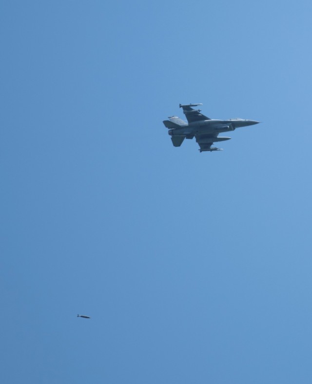 An Air Force F-16 Fighting Falcon flies over Fort McCoy, Wis., on Aug. 13, 2021. The fighter jet was participating in the Northern Lightning 2021 exercise at nearby Volk Field, Wis. F-16s also dropped 500-pound Joint Direct Attack Munitions for...