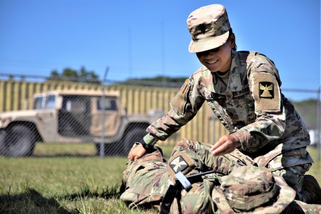 Spc. Casie Young, a human resources specialist with the 147th Human Resources Command, Minnesota National Guard, rolls a Soldier to check for injuries or bleeding during  Combat Lifesaver (CLS) Course on aug. 16, 2021, at Fort McCoy, Wis. The CLS...