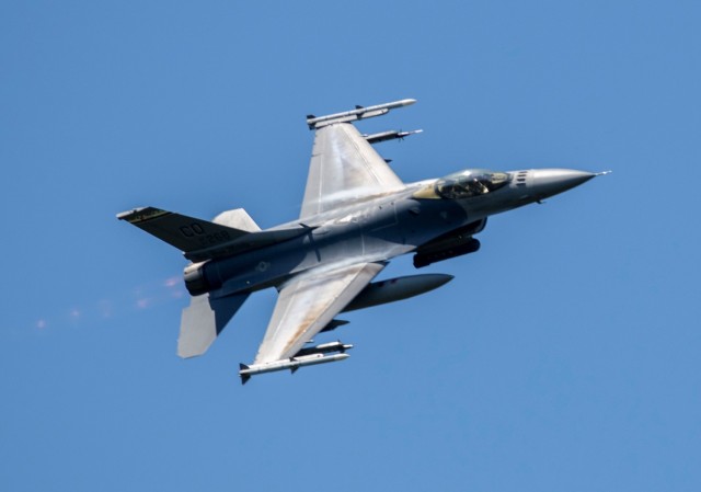 An Air Force F-16 Fighting Falcon flies over Fort McCoy, Wis., on Aug. 13, 2021. The fighter jet was participating in the Northern Lightning 2021 exercise at nearby Volk Field, Wis. F-16s also dropped 500-pound Joint Direct Attack Munitions for...