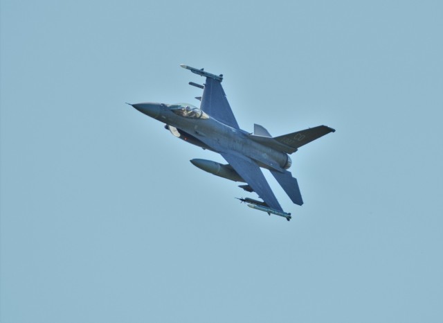 An Air Force F-16 Fighting Falcon flies over Fort McCoy, Wis., on Aug. 13, 2021. The fighter jet was participating in the Northern Lightning 2021 exercise at nearby Volk Field, Wis. F-16s also dropped 500-pound Joint Direct Attack Munitions for...