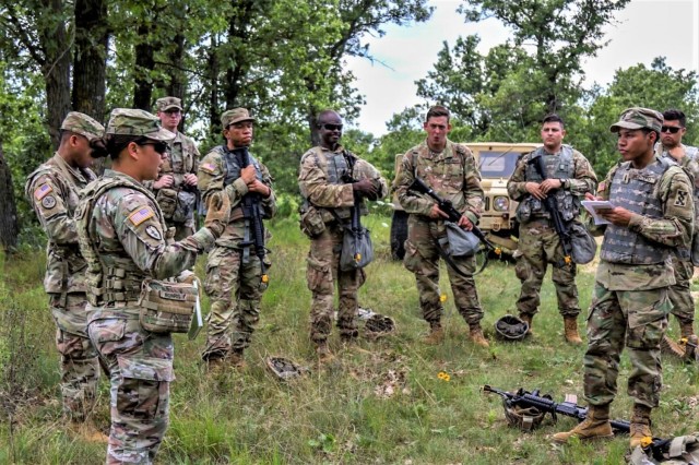 Capt. Crystal Morris (right), an observer coach/trainer (OC/T) with 3rd Battalion, 409th Brigade Support Battalion, 4th Cavalry Multi-Functional Training Brigade, conducts an after action review with U.S. Army Reserve Soldiers assigned to 196th...