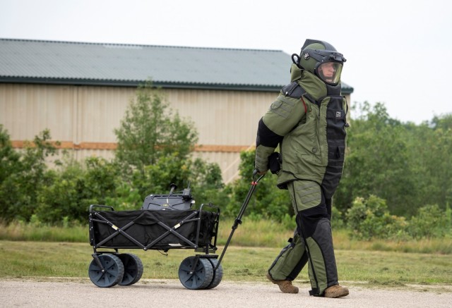 An Air National Guard explosive ordnance disposal Airman completes a training scenario July 28, 2021, at the Fort McCoy (Wis.) Combined Arms Collective Training Facility as part of the Audacious Warrior 2021 exercise. Since 2017, explosive...