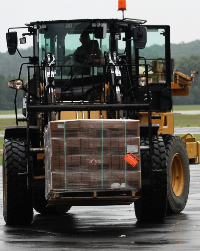 Airmen move cargo Aug. 5, 2021, at the Sparta-Fort McCoy Airport at Fort McCoy, Wis., in preparation for the exercise Patriot Warrior 2021. Patriot Warrior is Air Force Reserve Command's premier exercise, providing an opportunity for Reserve...