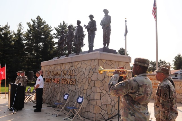 Sgt. Ryan Tatum with the 181st Multi-Functional Training Brigade plays 'Taps' on Sept. 10, 2021, during the 2021 Patriot Day observance at Fort McCoy, Wis. On Sept. 11, 2001, 19 militants associated with the Islamic extremist group al Qaeda...
