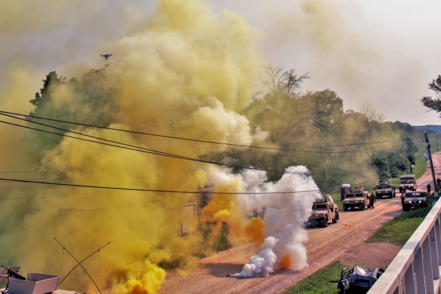 A tiny drone can be seen skimming through a simulated chemical attack against a Humvee convoy during the 86th Training Division Warrior Exercise (WAREX) 86-21-03 on July 19, 2021, at Fort McCoy, Wis. For the 2021 86th Training Division WAREX, it...