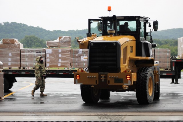 Airmen move cargo Aug. 5, 2021, at the Sparta-Fort McCoy Airport at Fort McCoy, Wis., in preparation for the exercise Patriot Warrior 2021. Patriot Warrior is Air Force Reserve Command's premier exercise, providing an opportunity for Reserve...