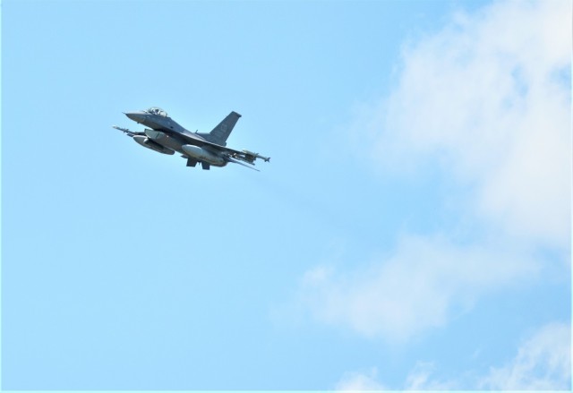 An Air Force F-16 Fighting Falcon flies over Fort McCoy, Wis., on Aug. 13, 2021. The fighter jet was participating in the Northern Lightning 2021 exercise at nearby Volk Field, Wis. F-16s also dropped 500-pound Joint Direct Attack Munitions for...