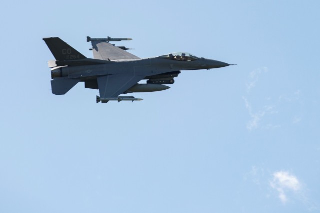 An Air Force F-16 Fighting Falcon flies over Fort McCoy, Wis., on Aug. 13, 2021. The fighter jet was participating in the Northern Lightning 2021 exercise at nearby Volk Field, Wis. F-16s also dropped 500-pound Joint Direct Attack Munitions for...