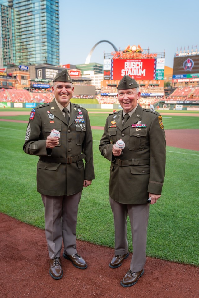 Maj. Gen. James Bonner, Maneuver Support Center of Excellence and Fort Leonard Wood commanding general (right), and MSCoE and Fort Leonard Wood Command Sgt. Maj. Randolph Delapena pose with baseballs Saturday during the pre-game ceremonies for the annual St. Louis Cardinals and AUSA Military Appreciation Game at Busch Stadium.