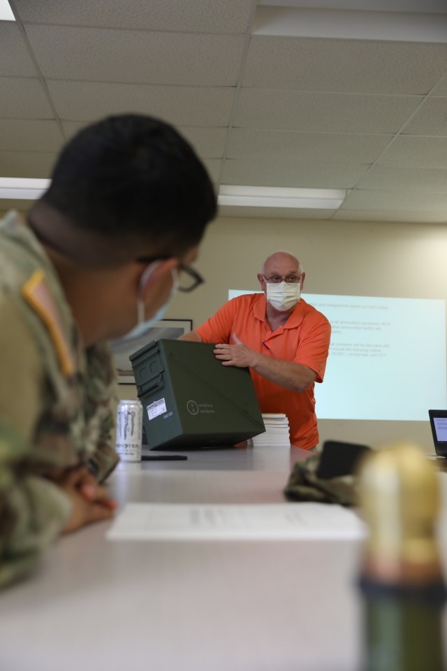 Kenneth Harwell, a quality assurance ammunition specialist, explains the process for lot numbers on ammunition containers to Soldiers from the 24th Ordnance Company, 87th Division Sustainment Support Battalion, 3rd Division Sustainment Brigade...