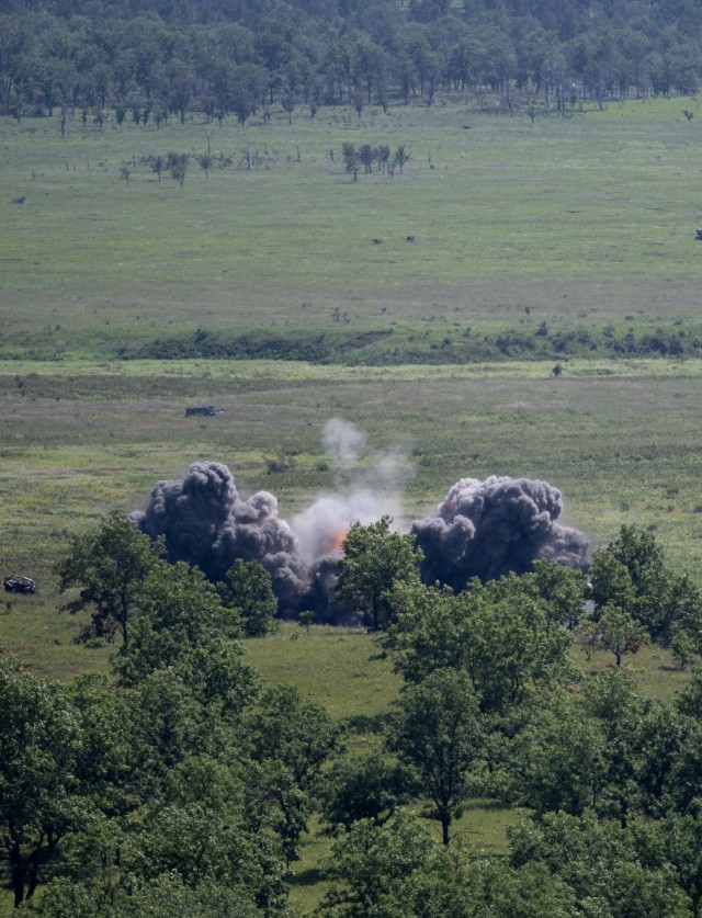 A 500-pound Joint Direct Attack Munition explodes on a target in the impact area after being dropped from an Air Force F-16 Fighting Falcon at Fort McCoy, Wis., on Aug. 13, 2021. The fighter jet action was part of the Northern Lightning 2021...