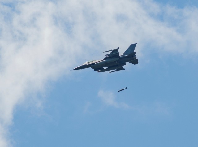 An Air Force F-16 Fighting Falcon flies over Fort McCoy, Wis., on Aug. 13, 2021. The fighter jet was participating in the Northern Lightning 2021 exercise at nearby Volk Field, Wis. F-16s also dropped 500-pound Joint Direct Attack Munitions for...
