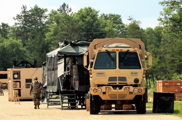 Soldiers prepare a mobile kitchen trailer for use Aug. 9, 2021, as part of operations for Combat Support Training Exercise 78-21-02 at Big Sandy Lake on South Post at Fort McCoy, Wis. Food rations used for the mobile kitchen trailer were made...