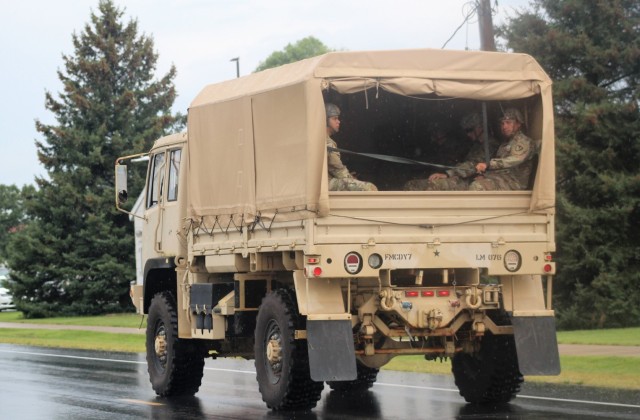 Soldiers ride in a military truck Aug. 27, 2021, at Fort McCoy, Wis., as part of training operations at the installation. For fiscal year 2021, post officials are expecting more than 100,000 troops to have trained at the installation — the most...