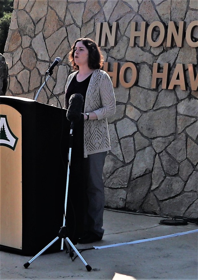 Retired Army Master Sgt. Mary Guthrie sings the national anthem during the Fort McCoy 2021 observance of Patriot Day and the 20th anniversary of the terrorist attacks of Sept. 11, 2001, on Sept. 10, 2021, at Veterans Memorial Plaza at the historic...