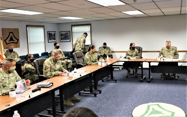 The 40th Chief of Staff of the U.S. Army Gen. James McConville (left) and other distinguished visitors listen as Fort McCoy Garrison Commander Col. Michael Poss gives a briefing Aug. 11, 2021, about the installation at the Fort McCoy (Wis.)...