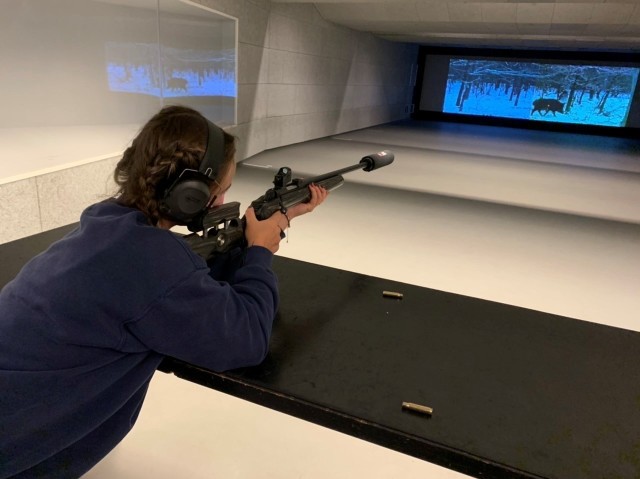 Shooter takes aim at a running boar simulation. 
(Photo by Steven Steininger)