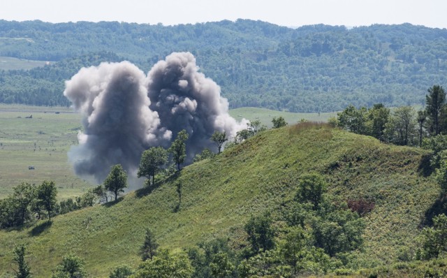 A 500-pound Joint Direct Attack Munition explodes on a target in the impact area after being dropped from an Air Force F-16 Fighting Falcon at Fort McCoy, Wis., on Aug. 13, 2021. The fighter jet action was part of the Northern Lightning 2021...