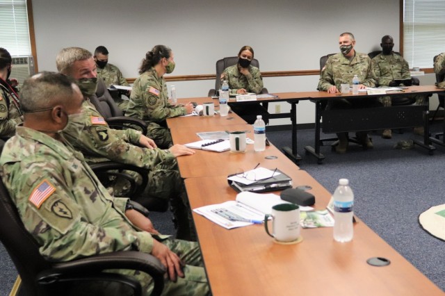 The 40th Chief of Staff of the U.S. Army Gen. James McConville (left) and other distinguished visitors listen as Fort McCoy Garrison Commander Col. Michael Poss gives a briefing Aug. 11, 2021, about the installation at the Fort McCoy (Wis.)...