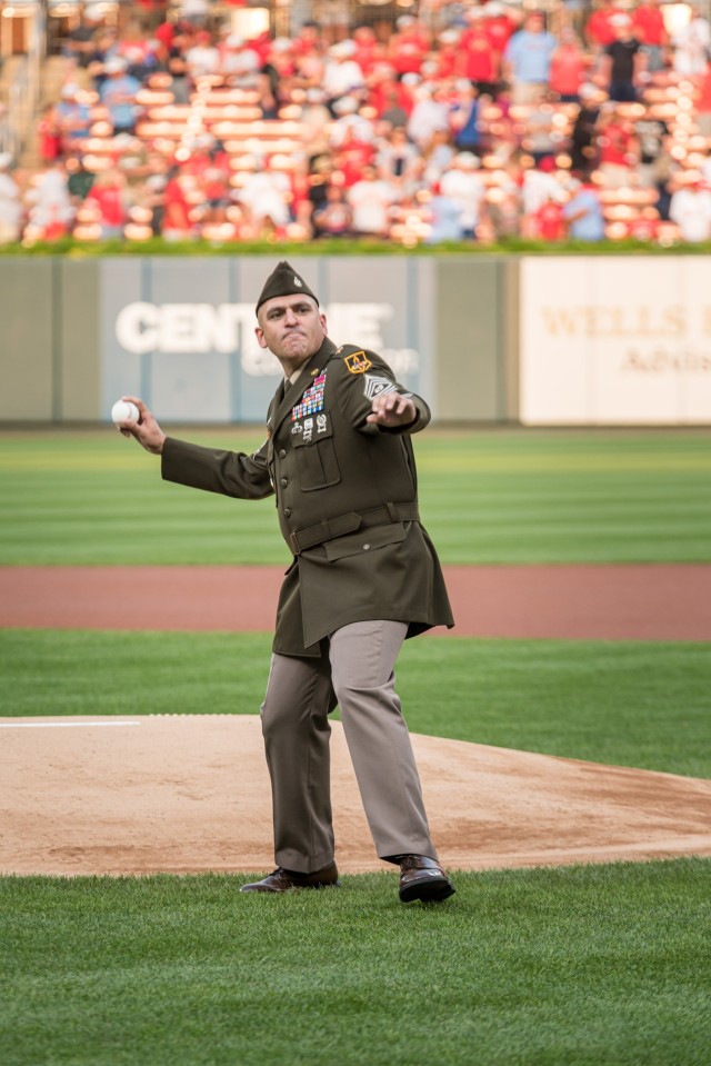 Maneuver Support Center of Excellence and Fort Leonard Wood Command Sgt. Maj. Randolph Delapena throws a ceremonial pitch Saturday during the pre-game ceremonies for the annual St. Louis Cardinals and AUSA Military Appreciation Game at Busch Stadium.