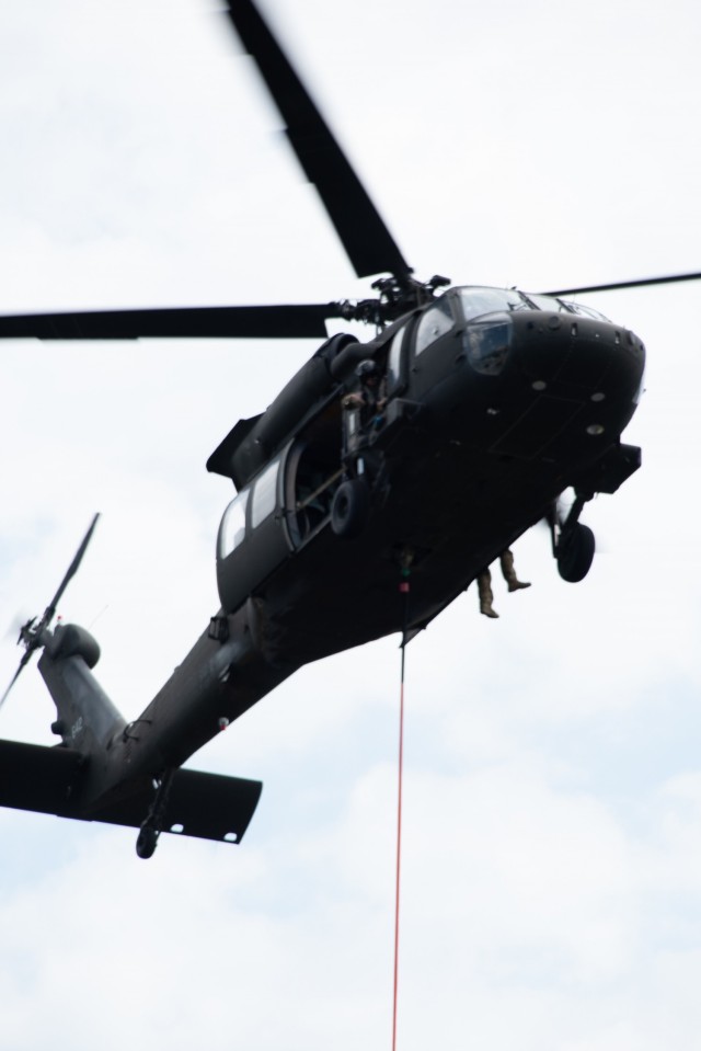 A Wisconsin Army National Guard UH-60 Black Hawk aircrew with the Madison, Wis.-based 1st Battalion, 147th Aviation Regiment train to drop water on wildfires Aug. 12, 2021, using Bambi buckets at a lake at Fort McCoy, Wis., in preparation for...