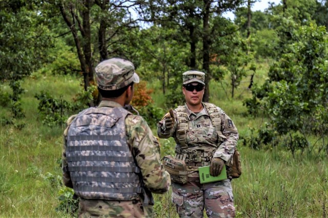 Capt Crystal Morris (right), an observer coach/trainer (OC/T) with 3rd Battalion, 409th Brigade Support Battalion, 4th Cavalry Multi-Functional Training Brigade, conducts an after action review with U.S. Army Reserve Soldiers assigned to 196th...
