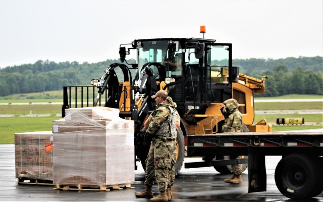 An Airman moves cargo Aug. 5, 2021, at the Sparta-Fort McCoy Airport at Fort McCoy, Wis., in preparation for the exercise Patriot Warrior 2021. Patriot Warrior is Air Force Reserve Command's premier exercise, providing an opportunity for Reserve...