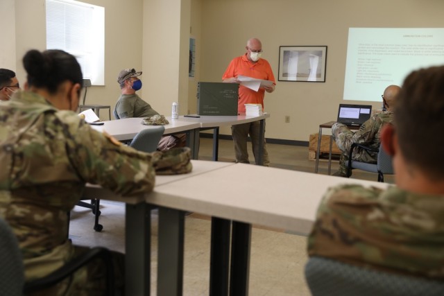 Kenneth Harwell, a quality assurance ammunition specialist, instructs Soldiers from the 24th Ordnance Company, 87th Division Sustainment Support Battalion, 3rd Division Sustainment Brigade on identifying ammunition markings during a...
