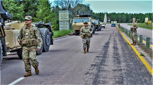 Capt. Crystal Morris (middle), an observer coach/trainer (OC/T) with 3rd Battalion, 409th Brigade Support Battalion, 4th Cavalry Multi-Functional Training Brigade, observes Soldiers with 196th Transportation Company as they fight through an ambush...