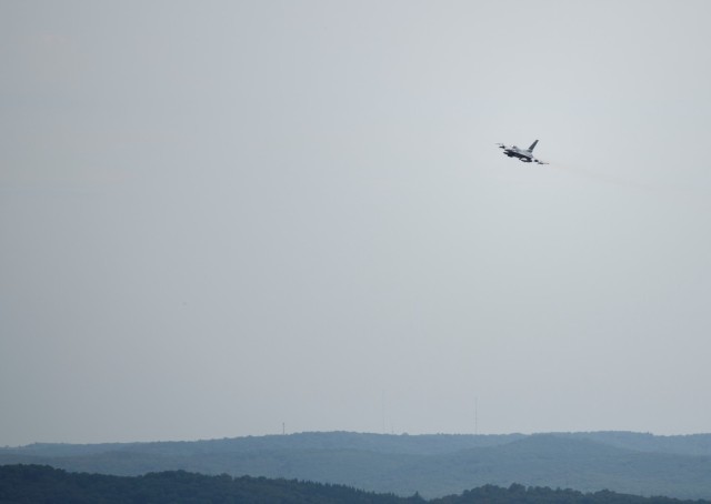 An Air Force F-16 Fighting Falcon flies over Fort McCoy, Wis., on Aug. 13, 2021. The fighter jet was participating in the Northern Lightning 2021 exercise at nearby Volk Field, Wis. F-16s also dropped 500-pound Joint Direct Attack Munitions for...