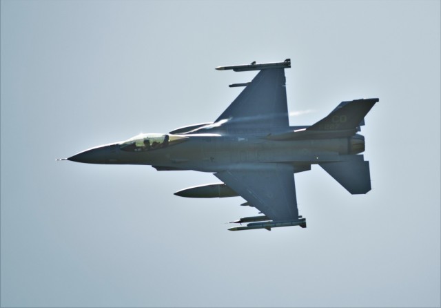 An Air Force F-16 Fighting Falcon flies over Fort McCoy, Wis., on Aug. 13, 2021. The fighter jet was participating in the Northern Lightning 2021 exercise at nearby Volk Field, Wis. F-16s also dropped 500-pound Joint Direct Attack Munitions for...