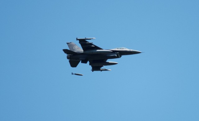 An Air Force F-16 Fighting Falcon flies over Fort McCoy, Wis., on Aug. 13, 2021. The fighter jet was participating in the Northern Lightning 2021 exercise at nearby Volk Field, Wis. F-16s also dropped 500-pound Joint Direct Attack Munitions for...