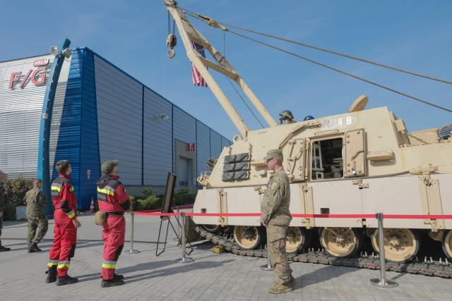 Spc. Ryan Brower, an M1 Abrams Tank System Maintainer assigned to 2nd Battalion, 34th Armored Regiment, 1st Armored Brigade Combat Team, 1st Infantry Division, explains the capabilities of the M88A2 Improved Recovery Vehicle (Hercules) to Polish first responders at an international defense industry exhibition known as Międzynarodowy Salon Przemysłu Obronnego in Kielce, Poland, Sept. 8, 2021. MSPO is a high-profile, international exhibition designed to showcase the latest land, sea, air and national security defense systems and military projects to a highly specialized audience from the Polish and international community. The 1st Infantry Division represented the U.S. Army at the event, showcasing equipment reflecting their armored and aviation rotational forces currently supporting Atlantic Resolve across Europe. 