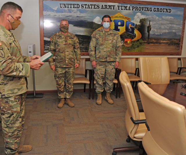 Yuma Proving Ground Commander Col. Patrick McFall and Command Sgt. Maj. Herbert Gill presented Maj. Joshua Chase with the Army Commendation Medal on behalf of the Secretary of the Army.